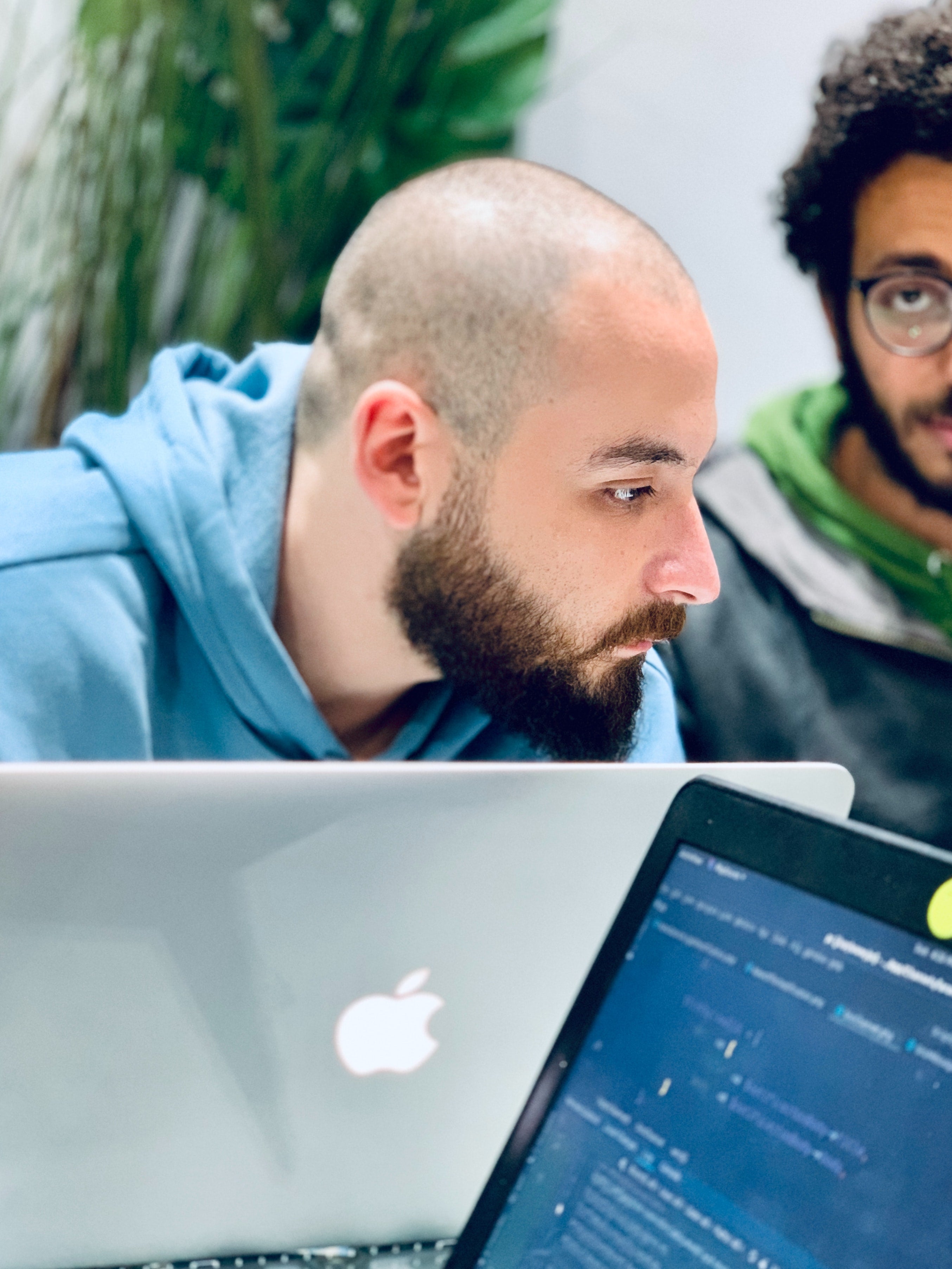 bald guy with a laptop