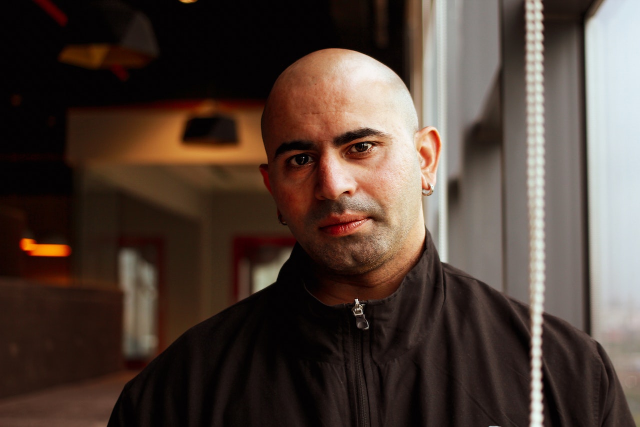 Bald guy looking on the camera