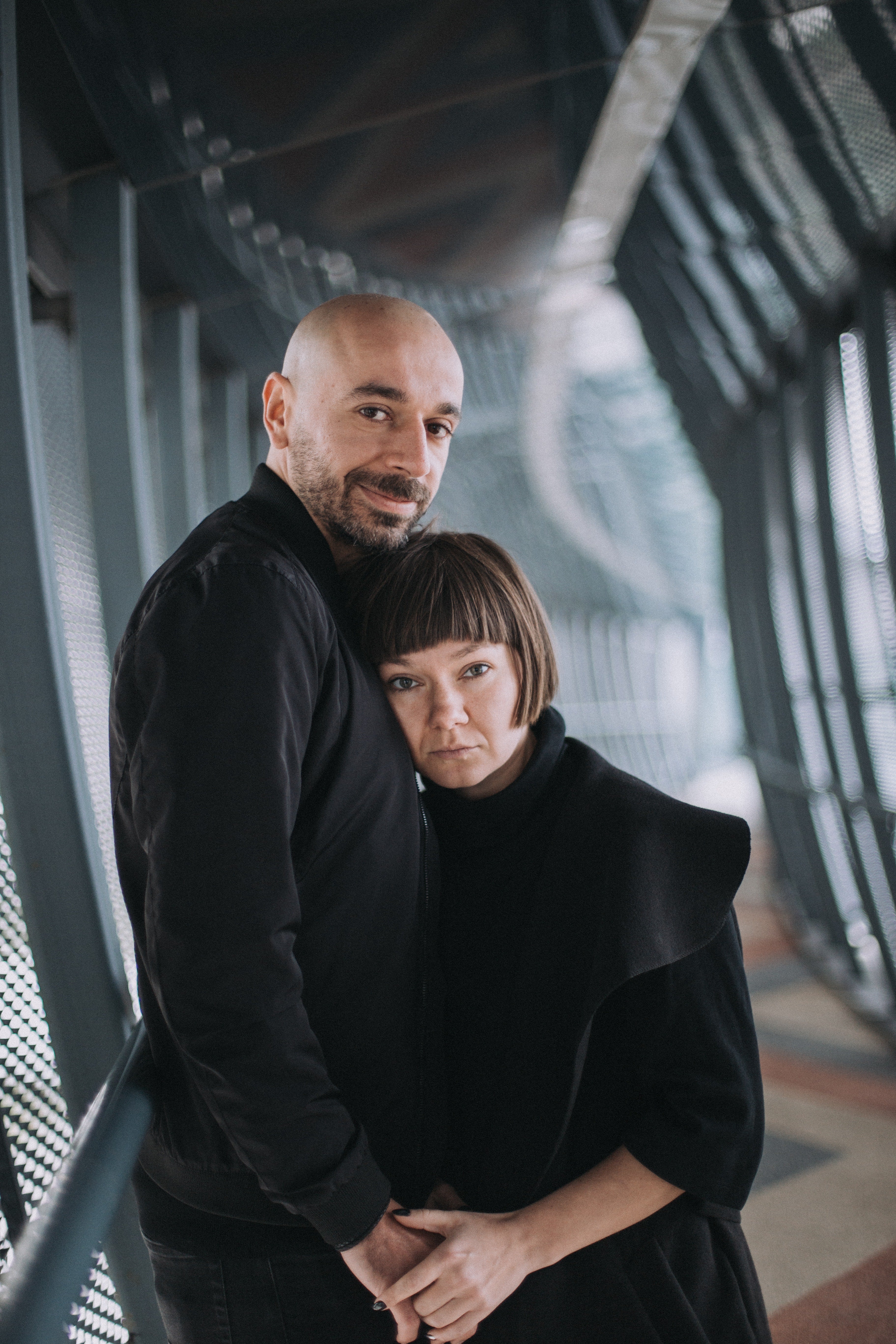Bald guy with a woman in black